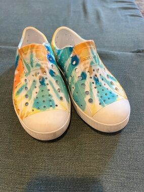 Native Shoes Kids Tie-Dye Slip-On Sneakers in Orange, Teal, and Yellow